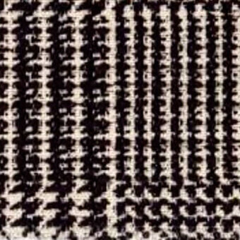Textile sample, dark beige and black, vertical columns of textured markings resembling abstract script with a rough woven fabric quality.